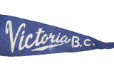 Blue felt vintage Victoria B.C. pennant with aged white script detail.