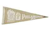 Vintage Philadelphia PA felt pennant, muted tan, with Betsy Ross House and Liberty Bell.