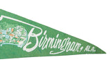 Textured green felt banner detail with white 'Birmingham' script and cityscape graphic.