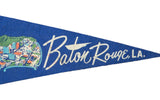 White script 'Baton Rouge LA' with boat graphic on vintage blue felt pennant.
