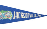 Blue felt Jacksonville Florida pennant with bold white text and downtown graphic.