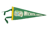 Vintage green felt Wichita, Kansas pennant with downtown buildings graphic and yellow ties.