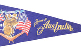 Yellow 'Souvenir of Australia' script on blue felt banner, beside American flag.