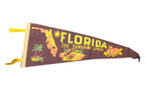 Vintage Florida Sunshine State felt pennant with yellow, orange, and dark brown graphics.