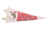 Vintage Montana felt flag banner, light pink with cowboy graphic and bold red letters.