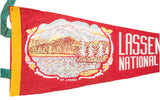Close-up of vintage red felt Lassen National Park pennant, Mt. Lassen graphic, white text.