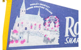 Vintage Roadside America felt pennant graphic of a white miniature village with pink accents.