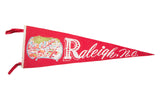 Vintage Raleigh NC felt flag banner with white text and colorful downtown buildings graphic.