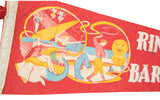 Red felt vintage circus banner, yellow graphic of elephant and female performers.