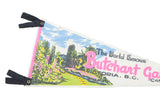 Black felt ties with metal grommets and bright garden graphic on vintage Butchart Gardens pennant.