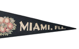 Vintage Miami Florida felt banner displaying 'MIAMI, FLA.' in cream lettering and peach oranges.