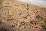 Intricate purple Bibikabad Persian rug pattern with peach, olive, and navy floral motifs.