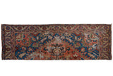 Antique Serapi rug runner fragment, vibrant geometric medallion in gem tones with natural patina.