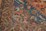 Antique Serapi runner corner with tattered edge, sapphire blue, cherry red, and visible foundation.