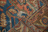 Reverse of an antique Serapi runner revealing hand-knotted foundation and tattered edges.