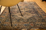 Distressed vintage Shiraz rug, muted navy, chocolate, blush geometric patterns, textured pile.