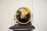 Mid Century 1950s Cram's black globe with vibrant continents on a gold stand.