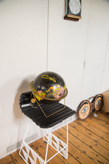 Mid Century Cram's black globe with original tag and colorful landmasses.
