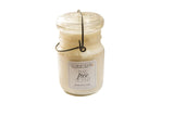 Reused vintage Ball jar candle with wire bail and off-white soy wax, 7.5 inches tall.
