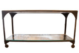 Antique industrial table with rough soapstone top, cast iron base, and glass shelf.