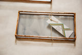 Handmade stained glass valet tray with copper finish, shown with the artist's tag.
