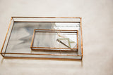 Two stained glass trays with copper finish; one opaque grey marble pattern, one clear.