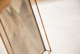 Copper-finished border and translucent glass panel of the stained glass tray.