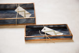 Small rectangular marbled deep blue black stained glass tray with copper patina edges.