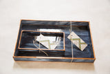 Marbled deep blue black glass with copper patina edges, shown nested with tags.