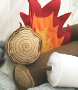 Kids Campfire Toy close-up, felt logs with stitched wood grain, white marshmallow and flames.