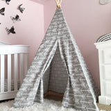 Gray teepee with white arrow pattern, wooden poles tied with rope, 5ft tall.
