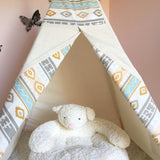 Open white cotton canvas kids teepee, highlighting the Southwestern pattern and plush teddy bear.