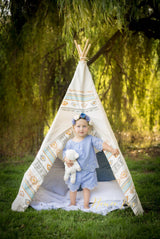 Kids Southwestern Teepee, white canvas with patterned accent fabric and child.