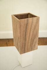 Handmade modern table lamp with textured walnut wood veneer and open top.