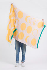 Yellow and pink handmade blanket with moon and circle patterns, green ribbed trim, 35x70 inches.