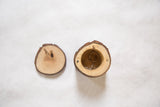 Open salvaged log wood box revealing two rings and internal magnets.