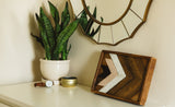 Rustic reclaimed wood wall art with nested dark, natural, and whitewashed arrowhead patterns.