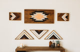 Reclaimed wood art display with Southwestern starburst, chevron patterns, whitewashed accents.