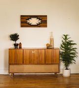 Reclaimed wood wall art showcasing Southwestern starburst in whitewashed, charred, and copper tones.