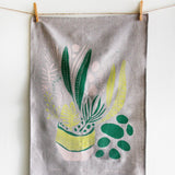Planty Tea Towel with botanical design, screen-printed in green and pink on natural linen.