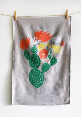 Leah Duncan linen tea towel, screen-printed green cactus with colorful flowers.