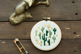 Multi Cactus Embroidery Art, hand-stitched green cacti with orange accents on a 4-inch hoop.