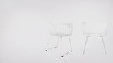 Two white modern Captain chairs with wireframe geometric design.