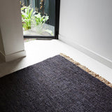 Charcoal hemp area rug with a thick, textured Sahara weave and natural fringe.