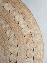 Natural hemp rug showcasing its intricate Dandelion weave and unique texture.