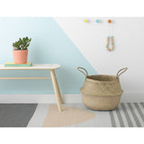 Natural Belly Basket with woven seagrass and two integrated handles.
