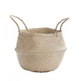 Braided handles and tight chevron weave of the natural seagrass basket.