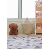 Handmade seagrass yellow teepee basket with geometric triangle motifs and lid.