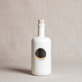 Handmade Moon Bottle, glossy white porcelain with gold waxing moon motif and cork.