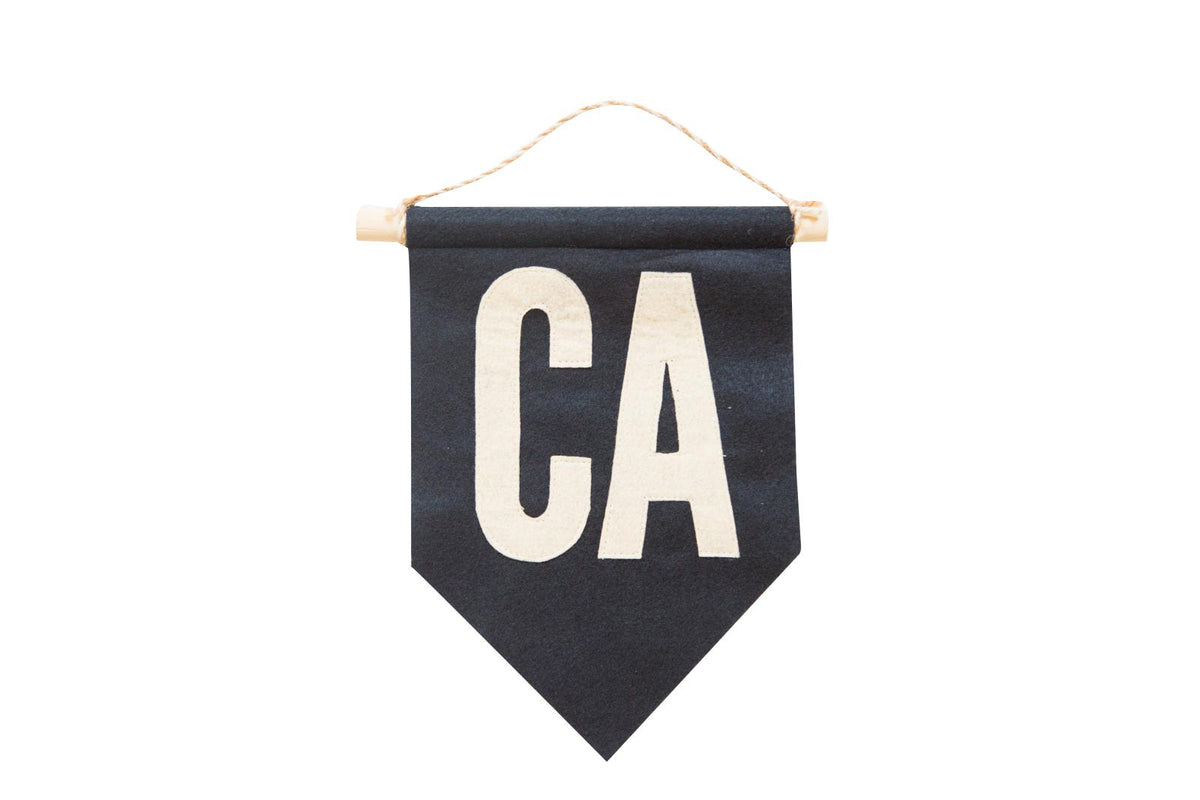 Handmade navy and cream CA felt flag with oak dowel and twine hanger, 7x10 inches.